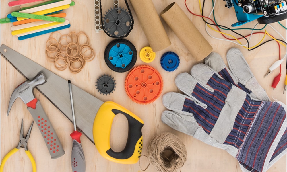 Tools and equipment on desk for a makerspace activity