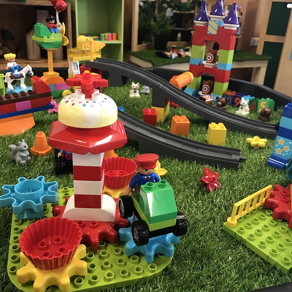 LEGO Steam Park fairground teacup ride with fairy tale castle in background