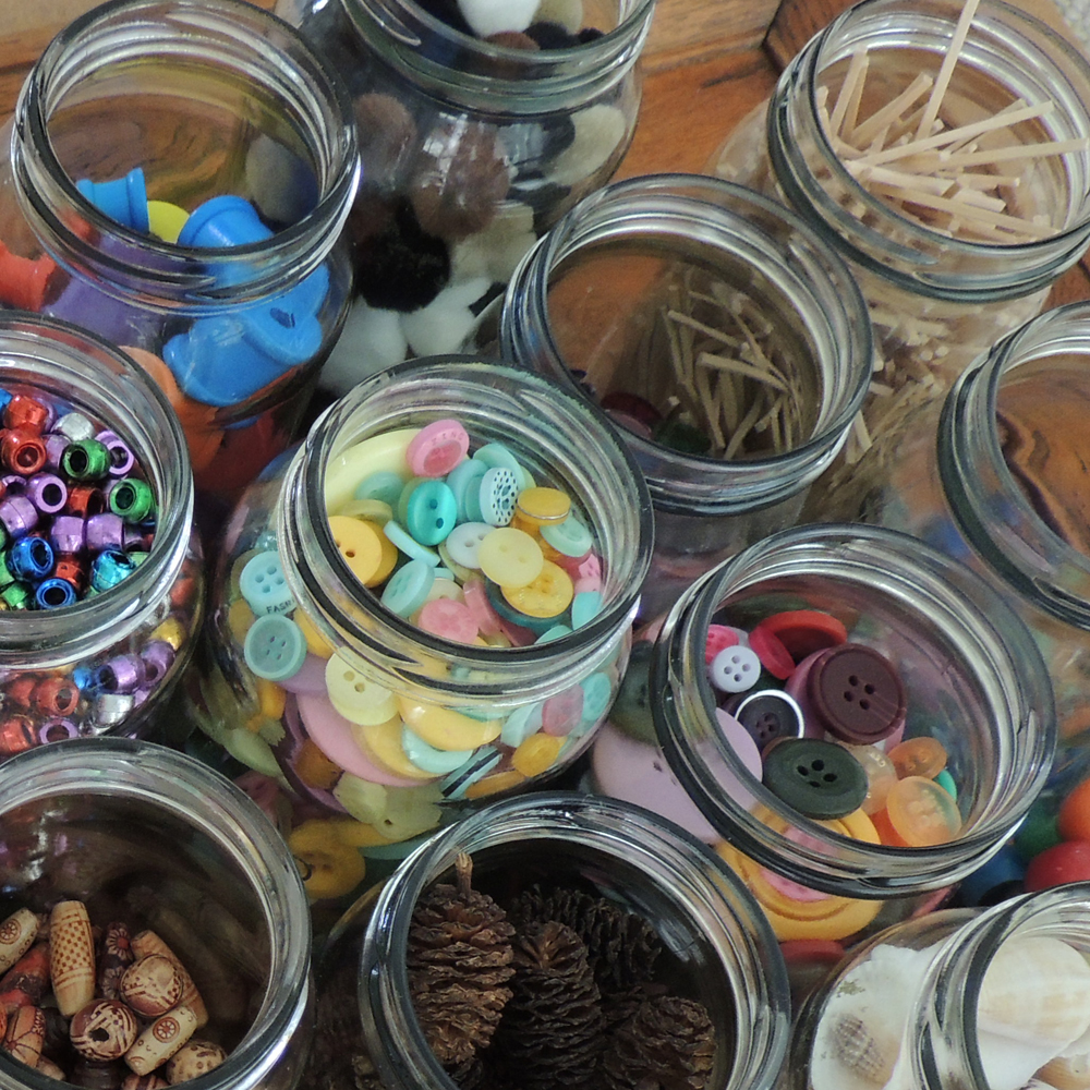 Arial shot of loose parts stored in glass jars