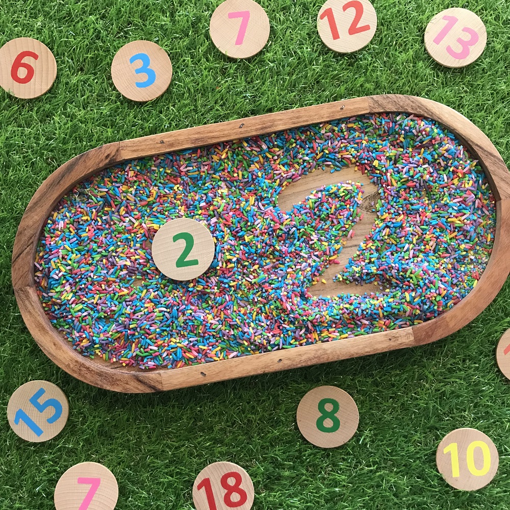 Numeracy Number Formation game in tray with coloured rice