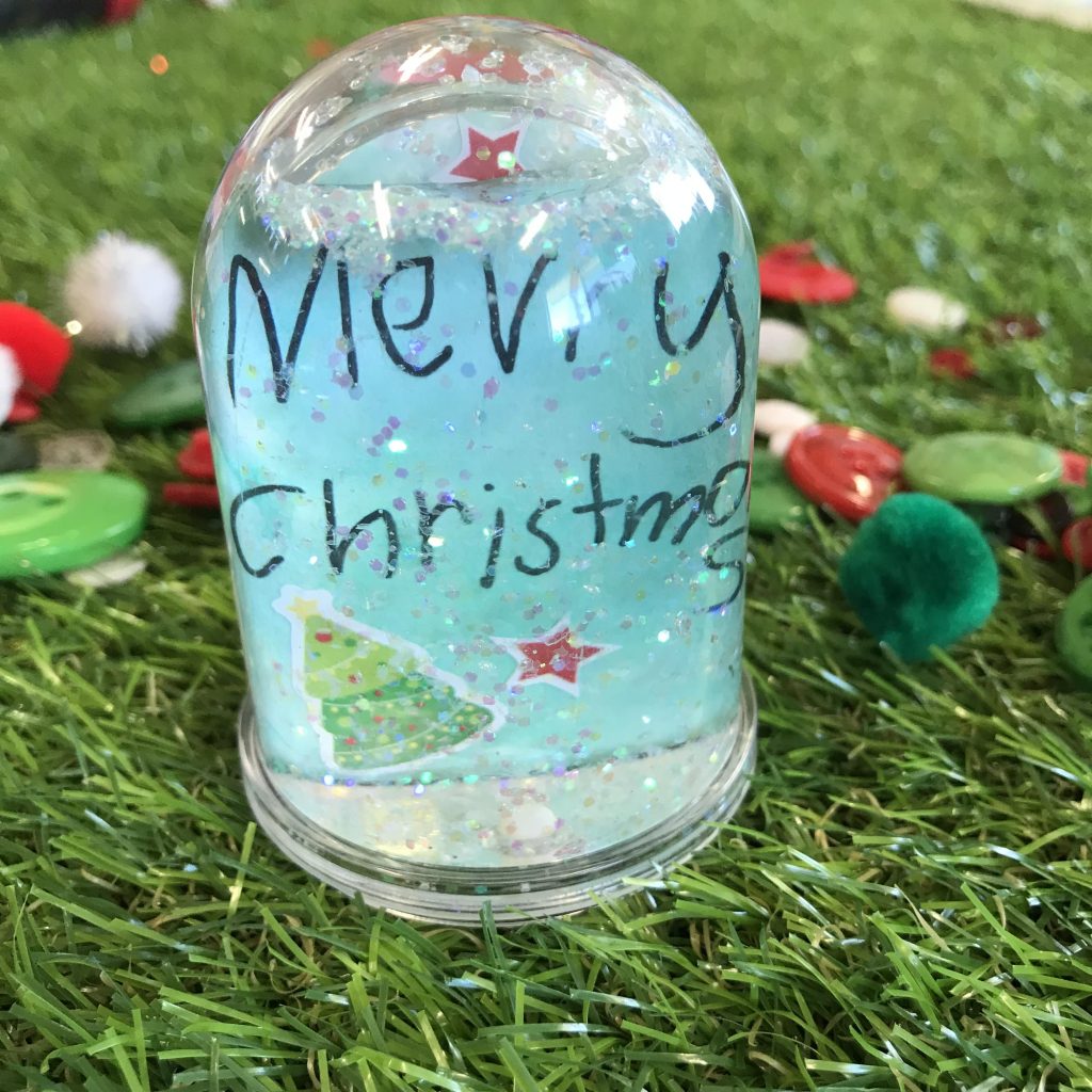Homemade snow globe with merry christmas message