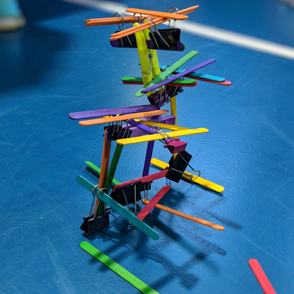 Makerspace towers activity using popsicle stick and foldback clips