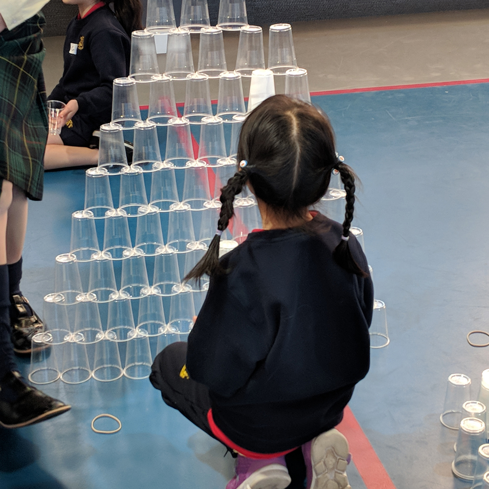 Makerspace cup towers challenge with kid