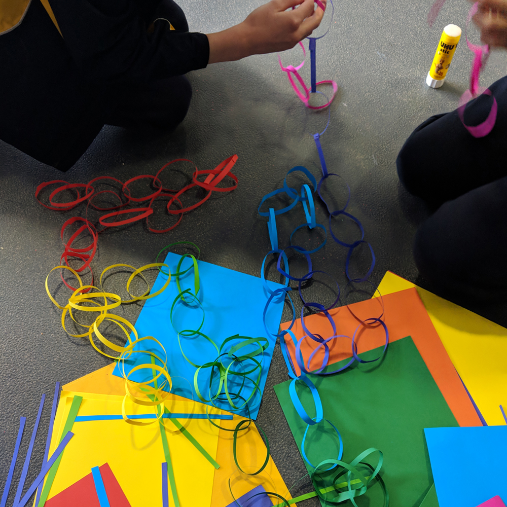 Makerspace longest paper chain challenge finished paperchains on floor