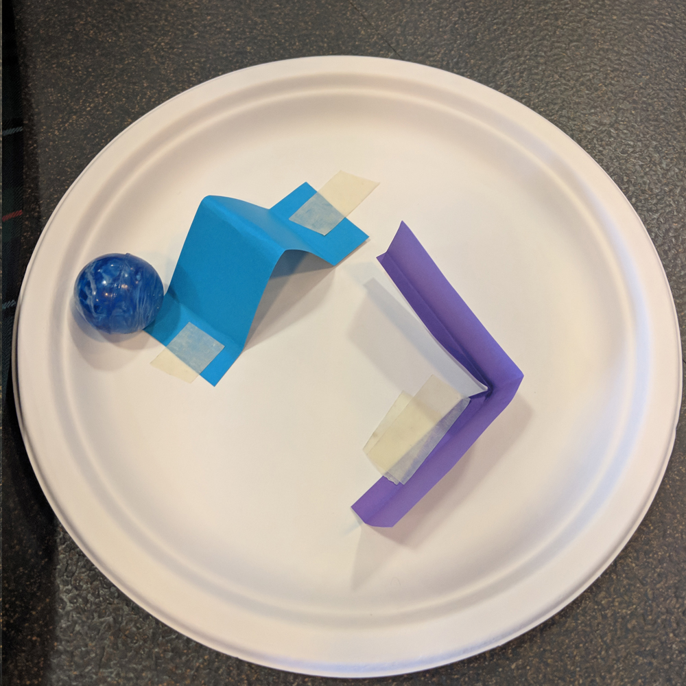 Makerspace marble mazes challenge prototype on plastic plate