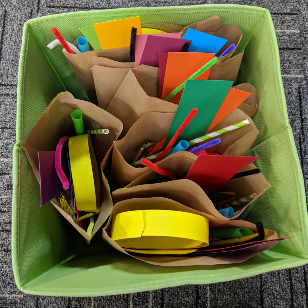 Makerspace mystery bag challenge materials in box