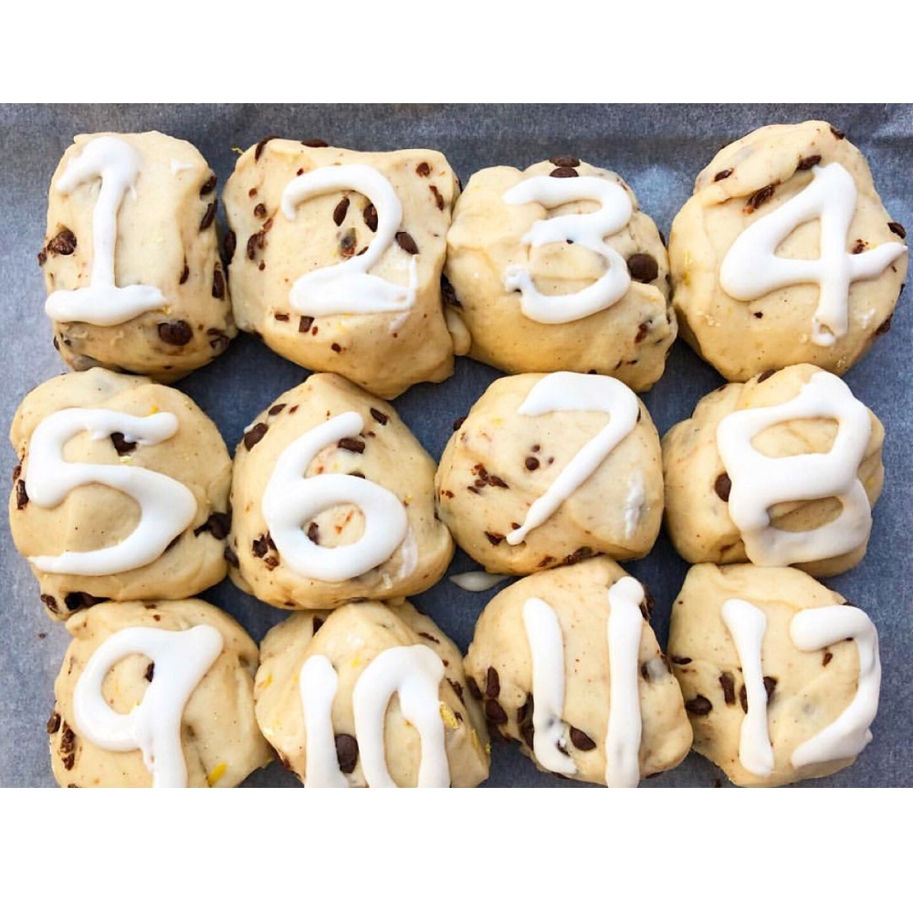 Twelve baked treats with numbers one to twelve written on top