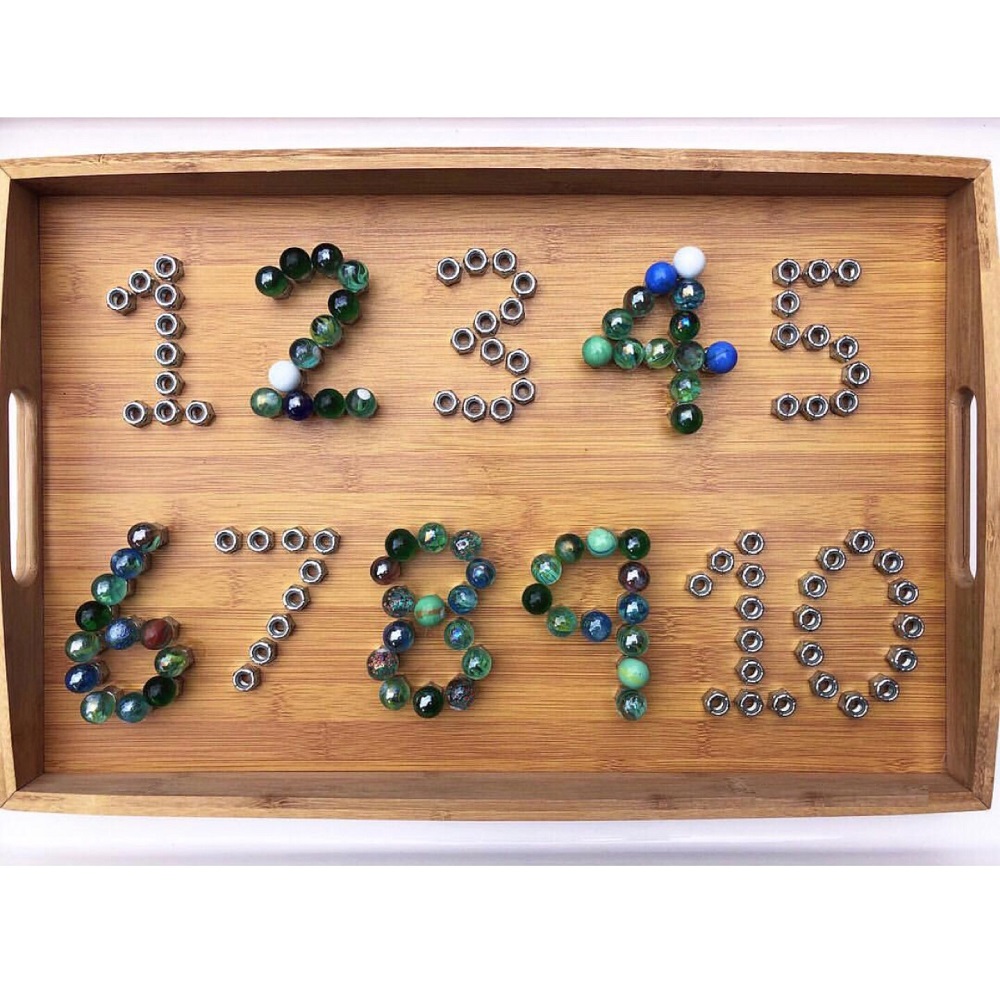 One to twelve numbers made up of marbles and bolts