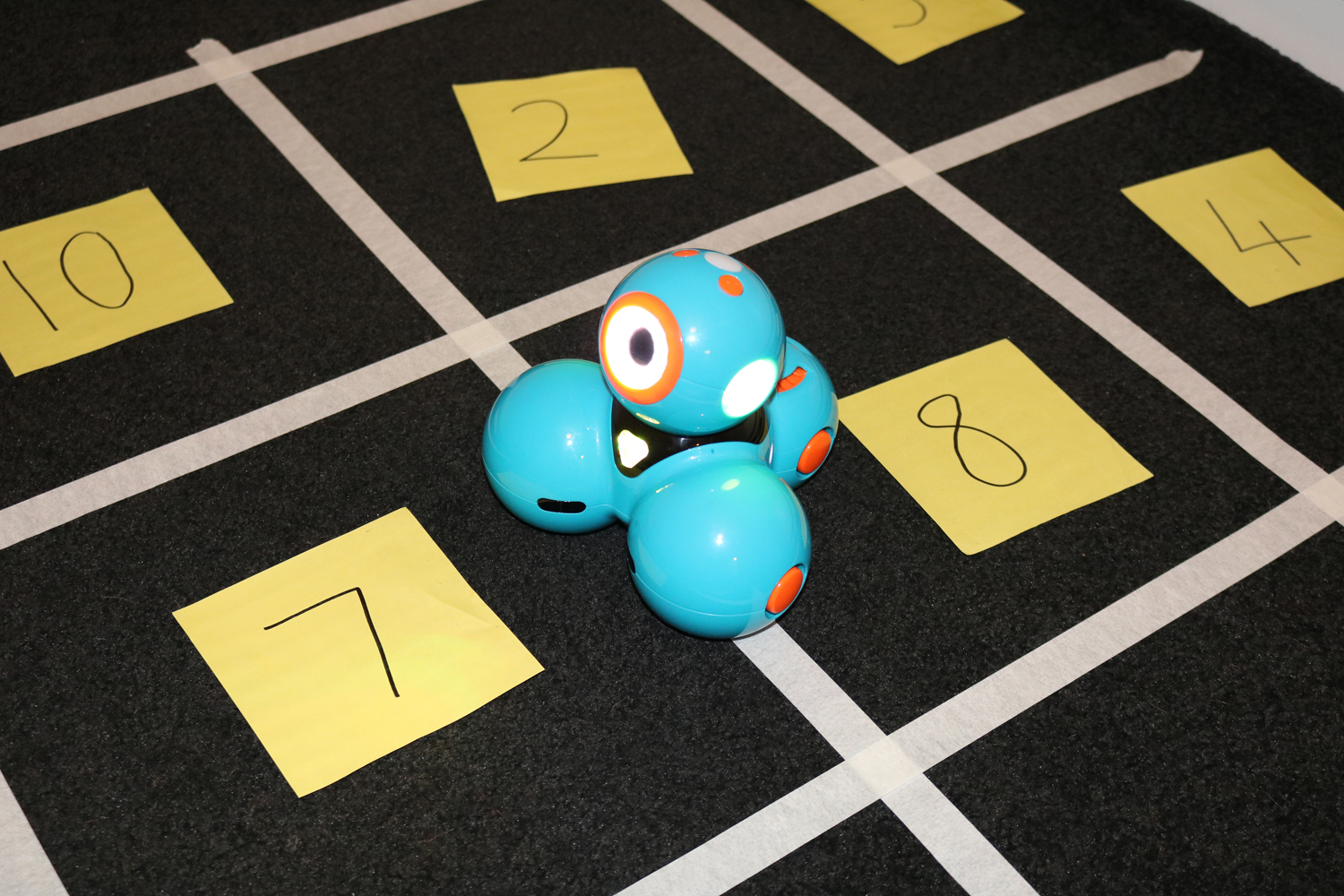 Dash number facts activity on square grid on floor