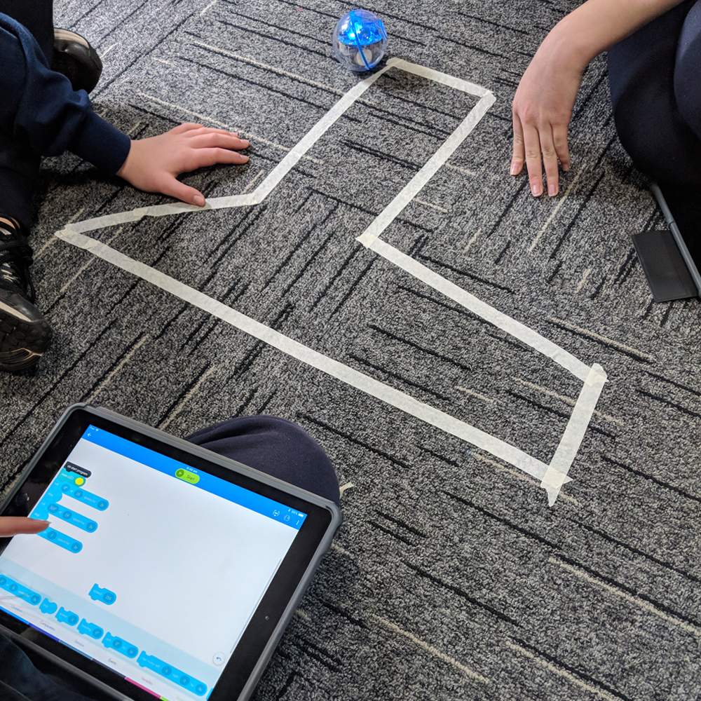 Sphero maths activity with shaped marked on floor