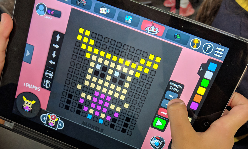 Child playing a Bloxels activity on iPad