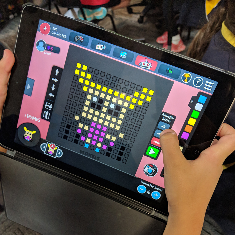 Child playing a Bloxels Literacy activity on iPad