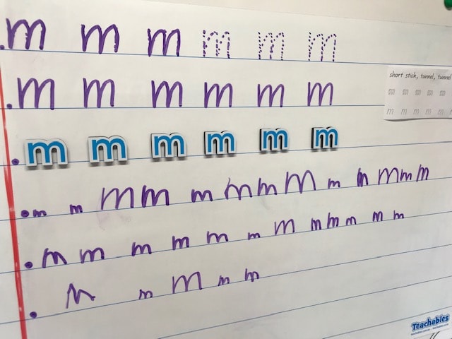 Whiteboard letter formation using the letter M