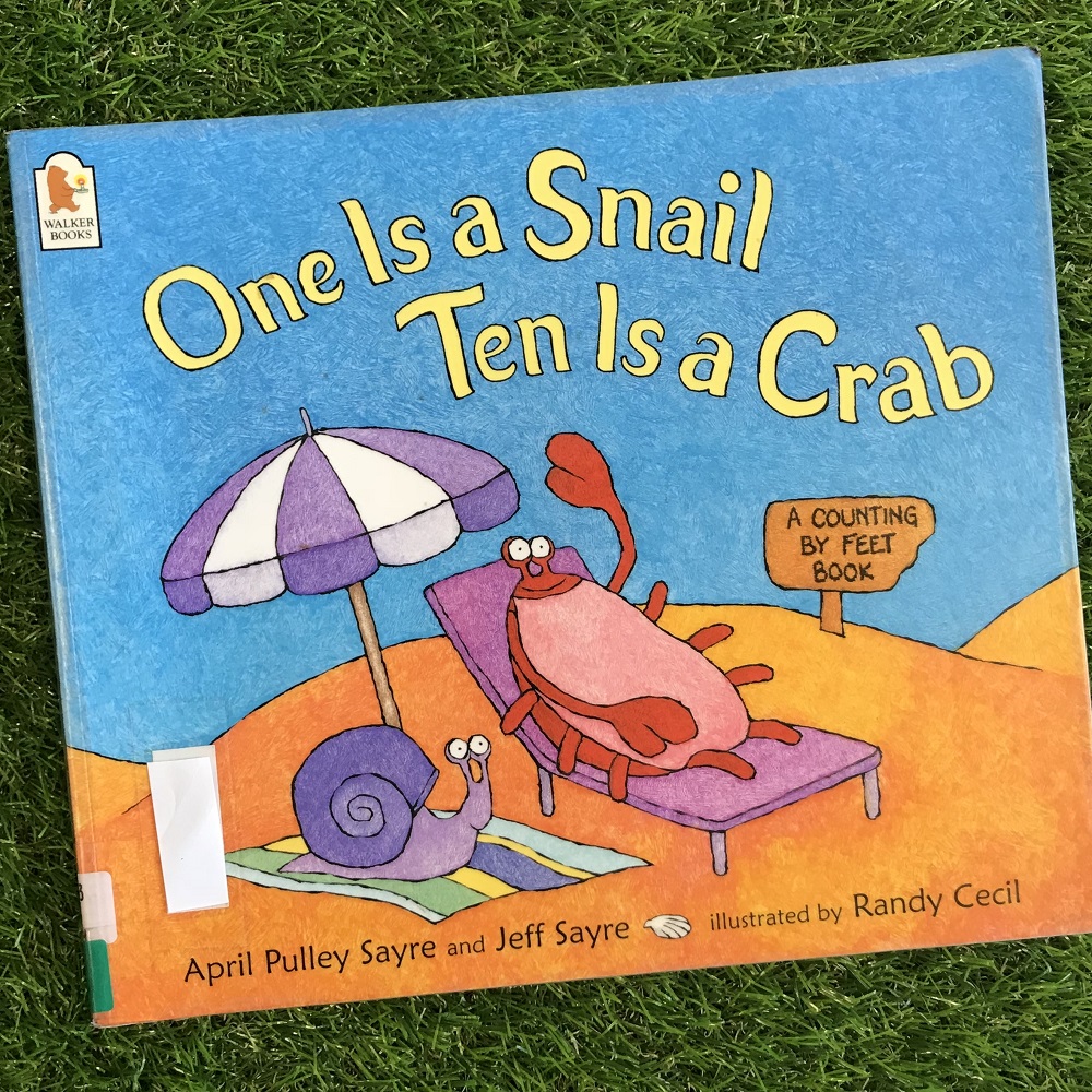 One is a Snail Ten is a Crab book on grass