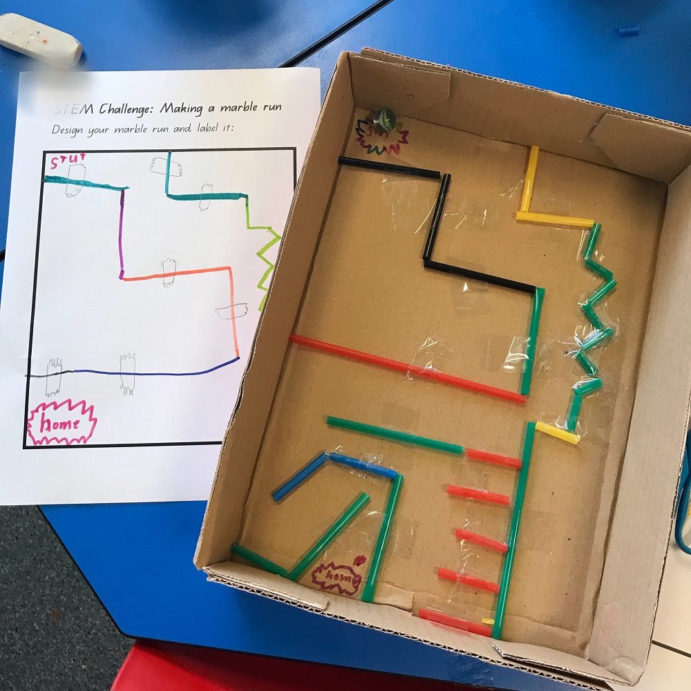 Marble maze built using cardboard box and straws