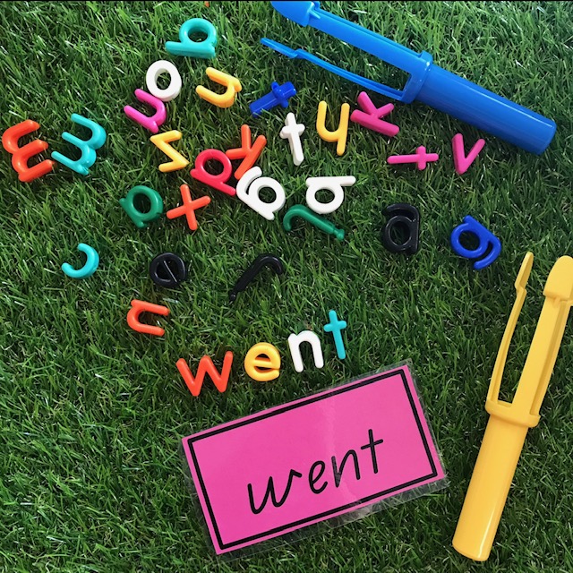 Lowercase letter beads sight word activity on grass background