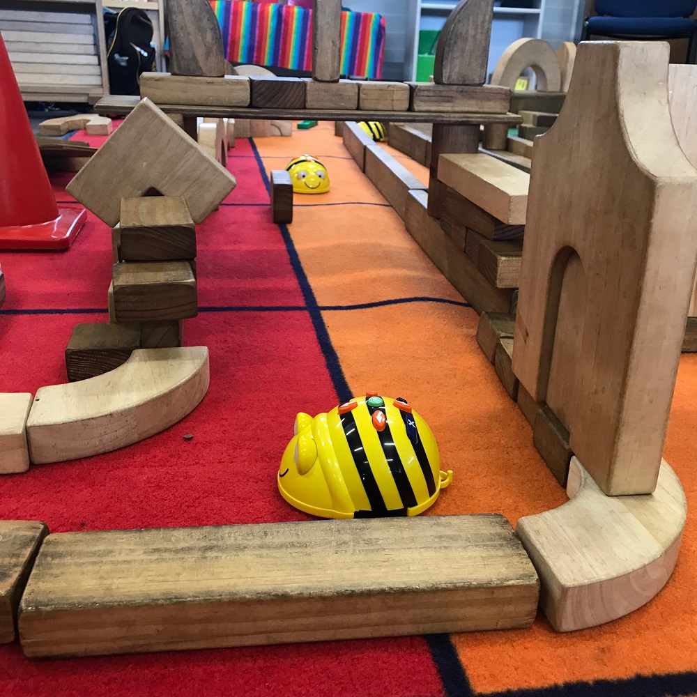 Close up shot of Beebot actively navigating through the wooden block maze