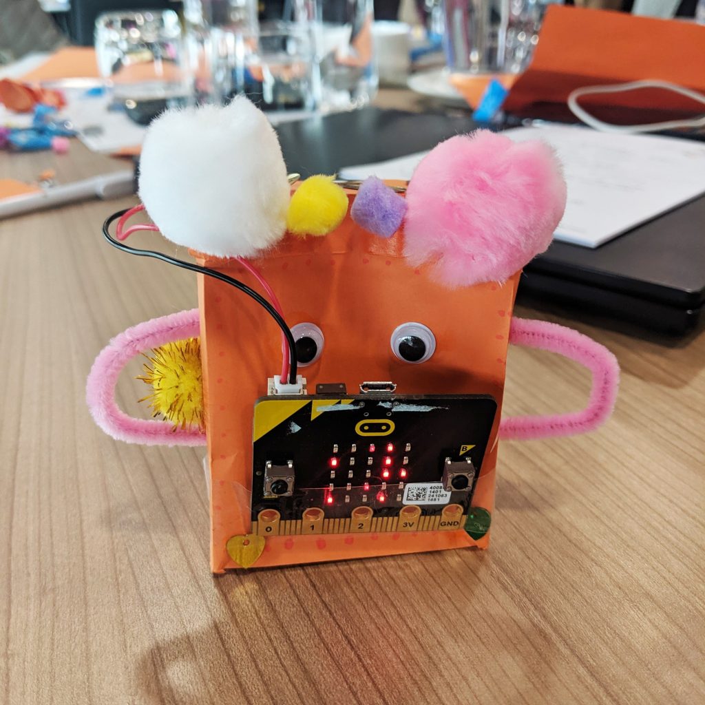 microbit pet orange on classroom desk