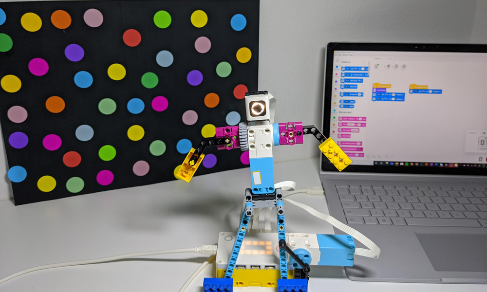 LEGO Education Spike Prime dancing robot and laptop in background