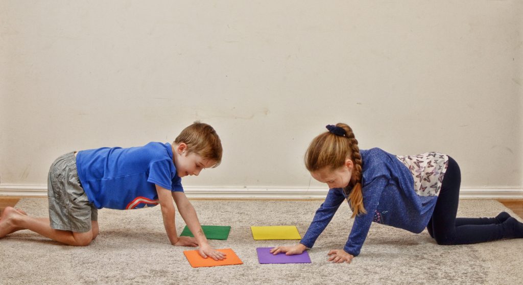 Staying Active at Home_ girl and boy crossing midline on floor