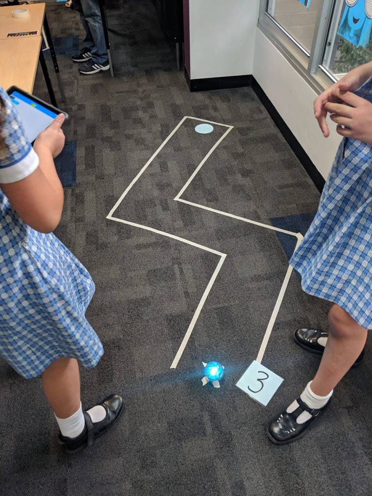 Sphero golf hole with 2 students and number 3