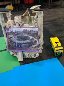 Sphero Integrated learning activity. Structure & bus made from newspapers. Picture of stadium