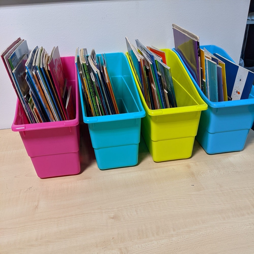 Book caddies filled with books on desk