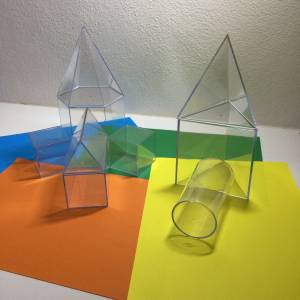 3D clear shapes on coloured card