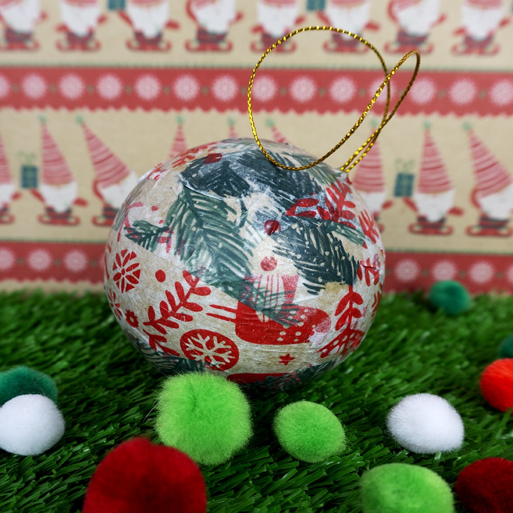 Tissue paper Christmas bauble with festive background