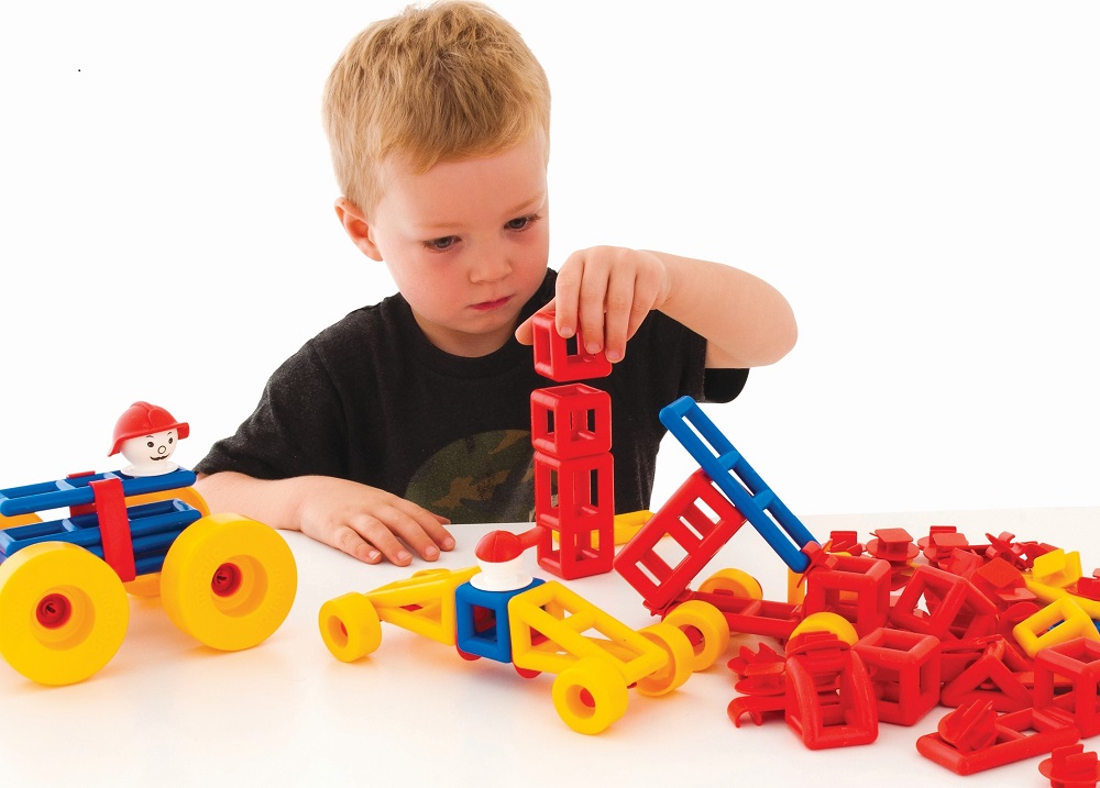 Child playing with Mobilo construction toy