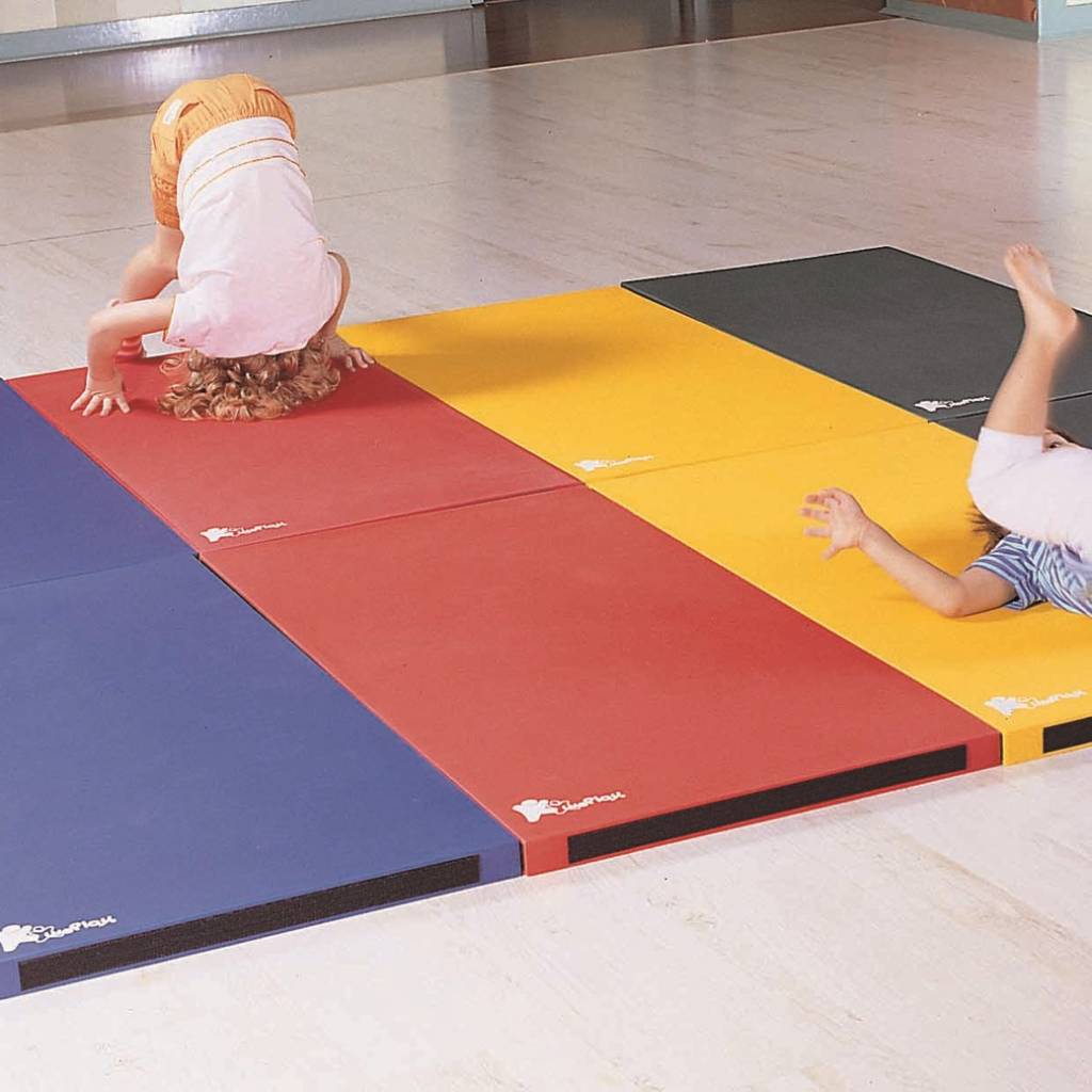 Kids ding front roll on exercise mats