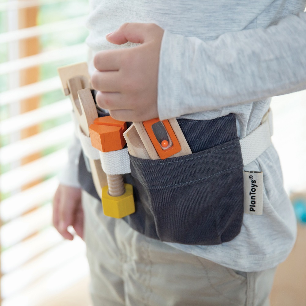 Wooden toolbelt toy on kid