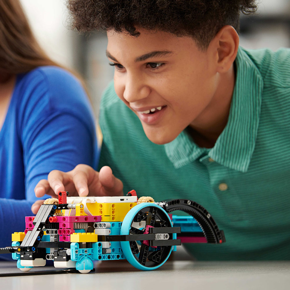 Boy holding SPIKE Prime Model