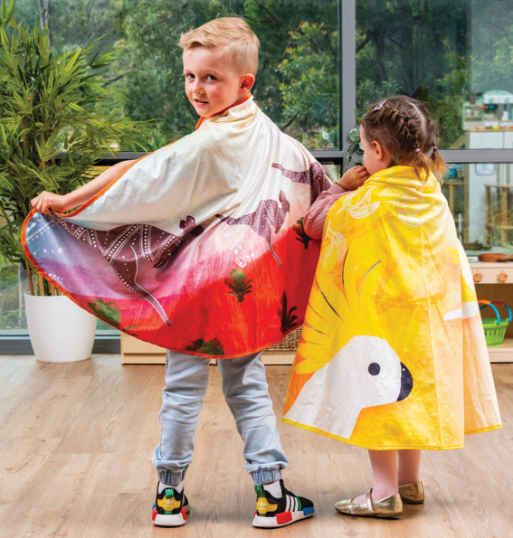 Children playing with dress-up capes