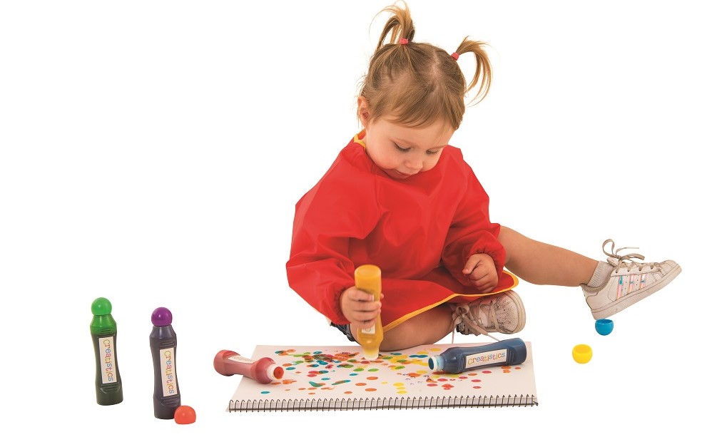 Child with dot maker paints