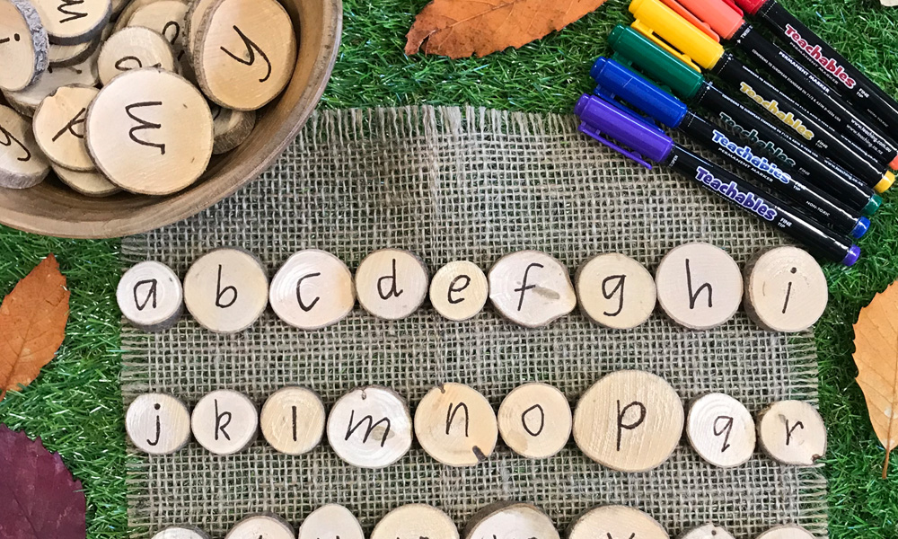Alphabet Wooden Discs Zoom With Teachables Markers And Leaf Border On Grass